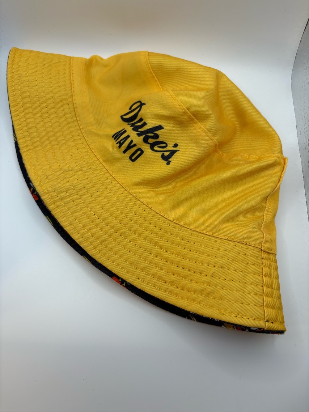 Duke’s Mayo Reversible Bucket Hat Yellow Black Mascot Print